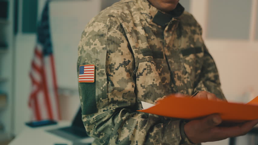 U.S. intelligence officer reading confidential papers, department of defense Royalty-Free Stock Footage #3402512167