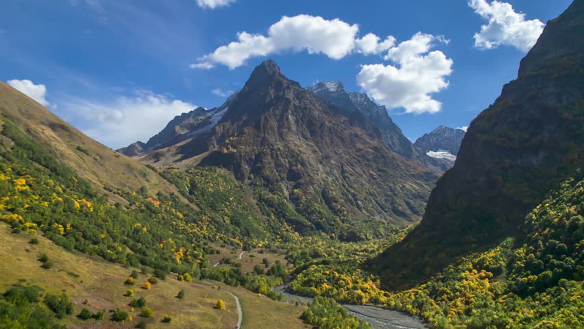 A beautiful aerial panorama of the mountain valley and picturesque mountain peaks. Landscape and nature of the North Caucasus