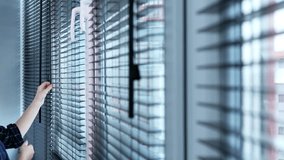 Open and close wooden blinds. Wooden horizontal jalousie , Close , women hand. - Powered by Shutterstock - Get 15% off with code: PIKWIZARD15