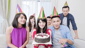 people smile happily with birthday party in the home