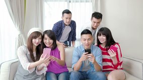young people use phone and smile happily