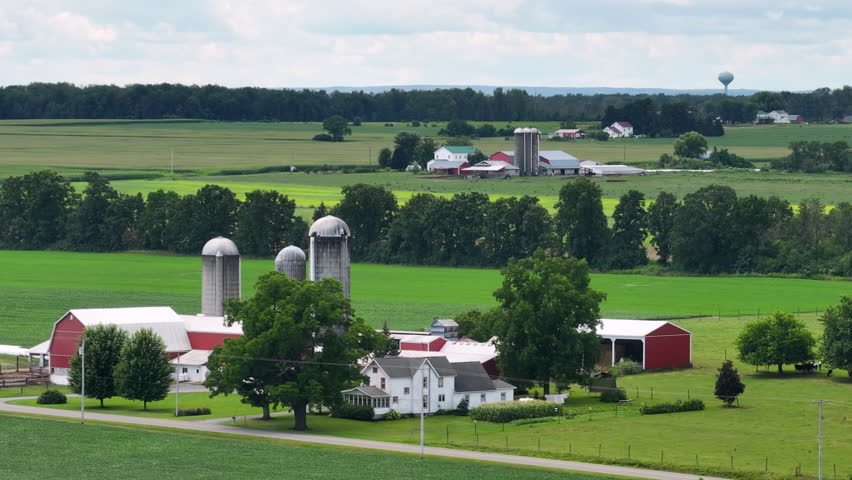 Farm barn and silos in rural Ohio, USA. American agricultural landscape