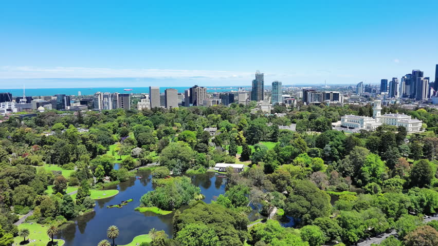 Melbourne, Australia: Aerial view of Royal Botanic Gardens Victoria in capital city of Victoria, sunny day with clear blue sky Royalty-Free Stock Footage #3402890129