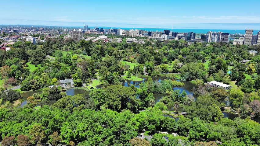 Melbourne, Australia: Aerial view of Royal Botanic Gardens Victoria in capital city of Victoria, sunny day with clear blue sky Royalty-Free Stock Footage #3402891537