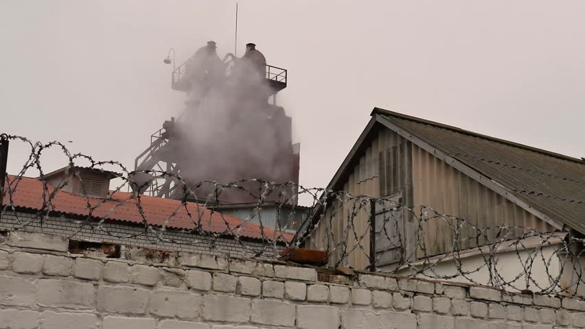 Industrial plant emissions. Industrial steam smokestack.