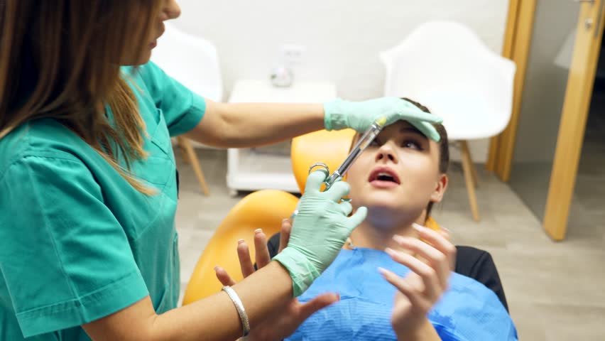 A Female Dentist Struggling to Stock Footage Video (100% Royalty-free