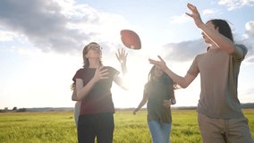 teenagers playing rugby in the park. group of teenagers play american football run outdoors in the park in summer. happy family kid dream concept. family teen lifestyle play american football run - Powered by Shutterstock - Get 15% off with code: PIKWIZARD15