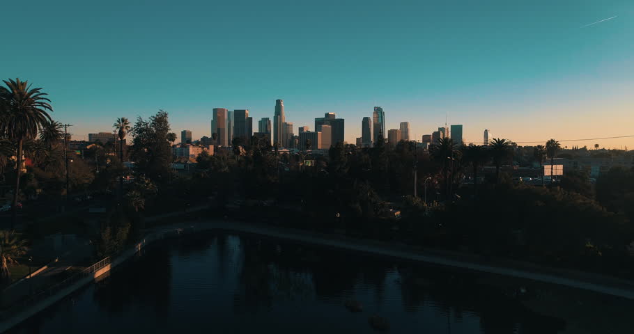 Cinematic aerial drone footage of downtown urban Los Angeles with city skyline, freeway and traffic below. Royalty-Free Stock Footage #34029892