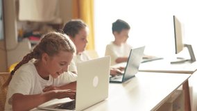 children learn from home through computers. business concept of modern training and development. group of little kids perform tasks in a laptop at lifestyle home schooling. educating from home - Powered by Shutterstock - Get 15% off with code: PIKWIZARD15