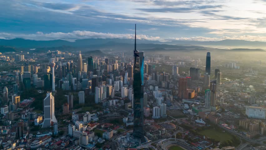 Aerial view time lapse 4k video of Kuala Lumpur city center view during dawn overlooking the city skyline in Federal Territory, Malaysia.  Royalty-Free Stock Footage #3403167427