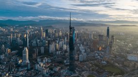 Aerial view time lapse 4k video of Kuala Lumpur city center view during dawn overlooking the city skyline in Federal Territory, Malaysia. 