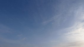 Cirrostratus clouds and blue sky. Time lapse. Sky background. Cloudscape.