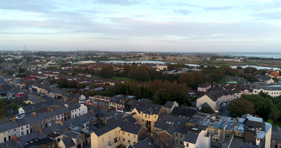 Slow panning drone shot during sunset over Galway, Ireland.