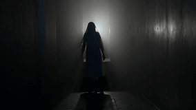 Portrait of ghost female in the house. Woman in white dress with veil covering her face walking in the room with flashing lightning. - Powered by Shutterstock - Get 15% off with code: PIKWIZARD15