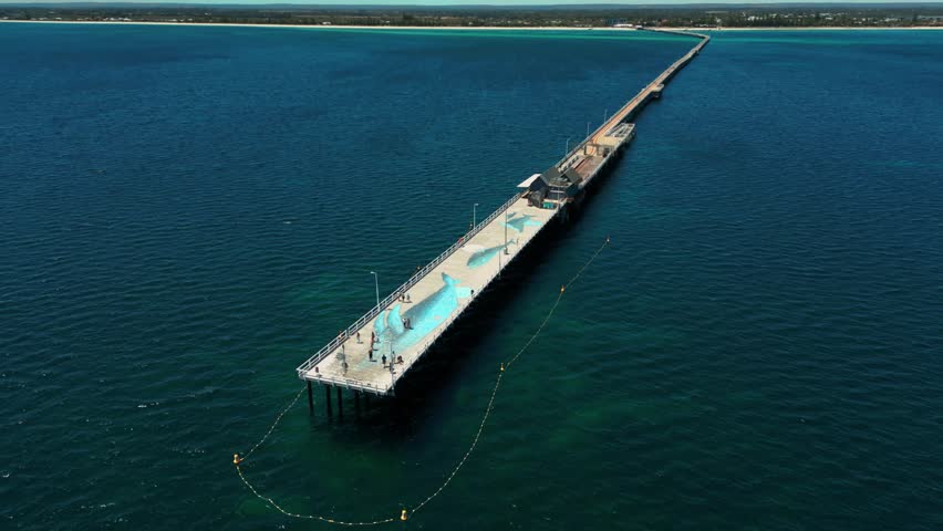 drone shot over the Busselton Jetty in Western Australia, the longuest Jetty in the Southern Hemisphere with almost 2km Royalty-Free Stock Footage #3403516801
