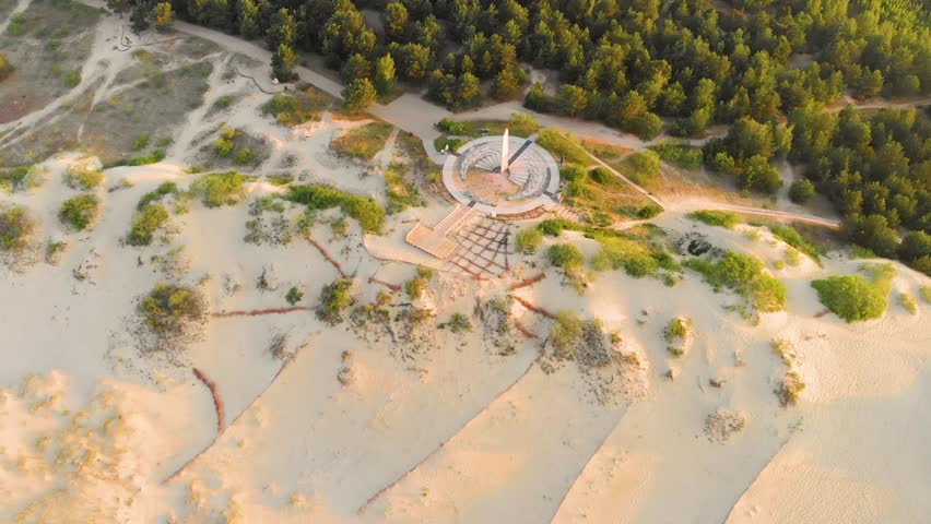 Aerial birds eye view the Curonian Spit landscape in summer with baltic sea coast and fir tree forests. Nida, Neringa, Lithuania. White sand Dunes, Dead Dunes. The Curonian Lagoon. Royalty-Free Stock Footage #3403551763