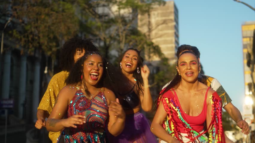 Carnival Rhythms in the Heart of Brazil, Friends in Harmony Dancing on Sunlit Streets. Festive Spirit Captured in Motion with Colorful Costumes and Smiles. Royalty-Free Stock Footage #3403553007