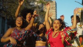 Carnival Rhythms in the Heart of Brazil, Friends in Harmony Dancing on Sunlit Streets. Festive Spirit Captured in Motion with Colorful Costumes and Smiles. - Powered by Shutterstock - Get 15% off with code: PIKWIZARD15