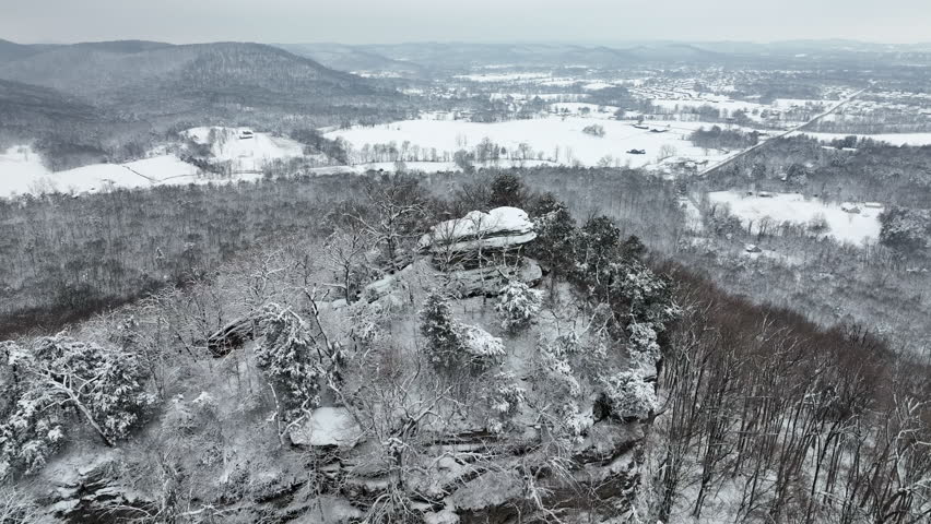 snow covered ground trail drone view