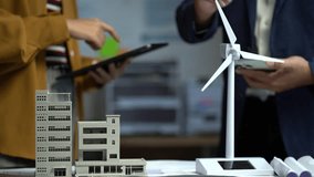 Businessman team brainstorming using tablet, laptop computer for working technology and business,  Renewable energy-based green businesses and global warming. Reduce CO2 emission. - Powered by Shutterstock - Get 15% off with code: PIKWIZARD15