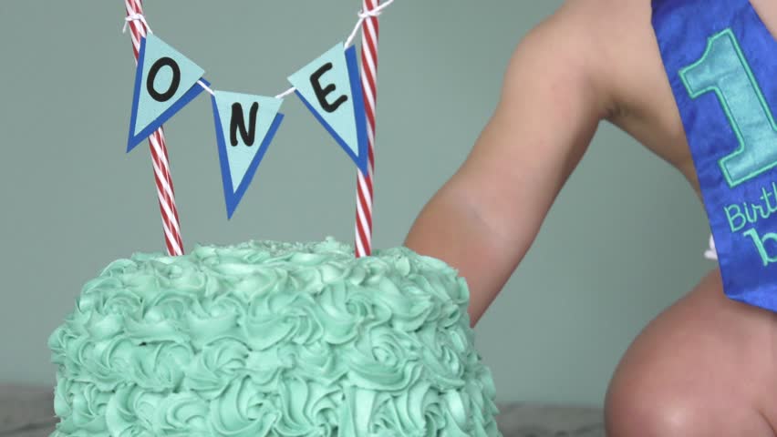 first birthday boy cake smash fist full of icing 4k