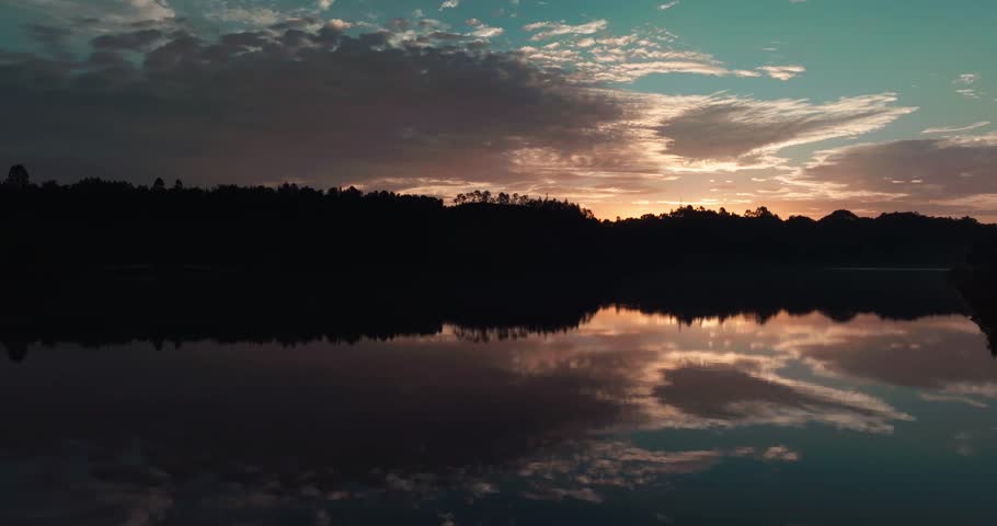 amazing aerial landscape of sunrise by the river reflection on the water surface
