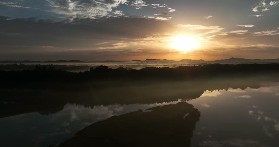 amazing aerial landscape of sunrise by the river reflection on the water surface