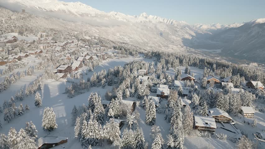 Crans Montana in Switzerland in the canton of Valais. Ski resort in deep snow. Roof covered with snow