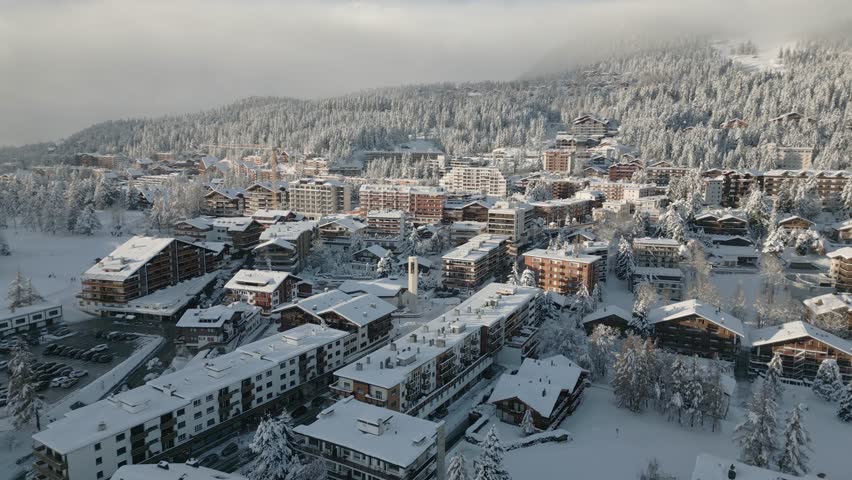 The luxury resort in Switzerland CRANS MONTANA in winter. Plenty of snow in the village. Winter landscape