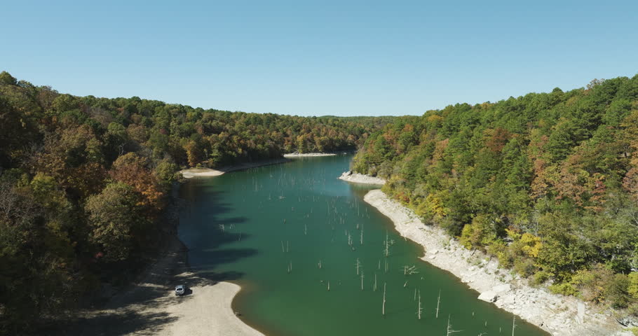 Aerial View Of Fall Forests On The Shore Of Beaver Lake In Arkansas, USA. ascending shot