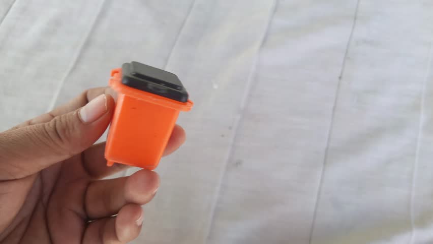 Miniature plastic trash can. Children