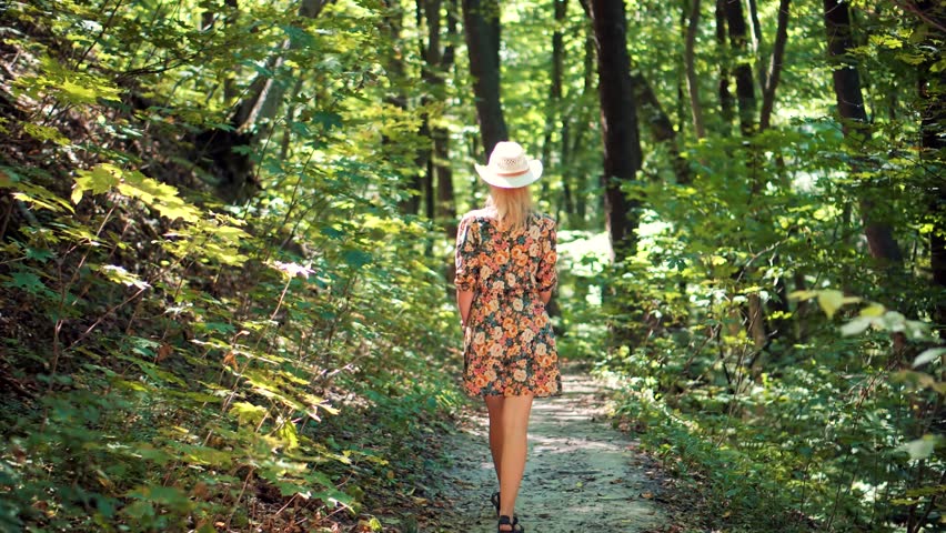 Relaxing Woman In Hat Walking Pine Forest.Holiday Vacation Tourist Journey Trip In Warm Day. Beautiful Healthy Girl In Dress Walking In Greenwood. Carefree Female Exploring Spruce Forest In Sunny Time Royalty-Free Stock Footage #3404068785