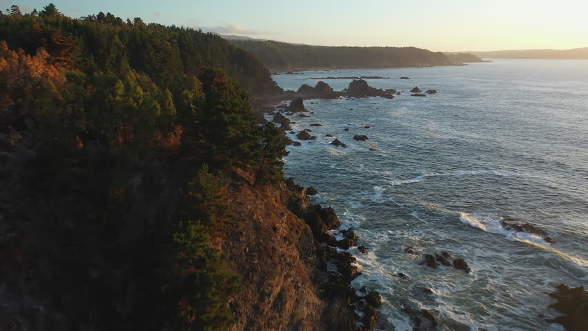 Epic Front Dolly Pacific Ocean Coastline Chile Forest Cliff Sunset Summer Waves Pines Royalty-Free Stock Footage #3404069997