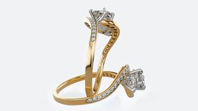 2 yellow gold isolated wedding and engagement rings with diamonds and white background - Powered by Shutterstock - Get 15% off with code: PIKWIZARD15