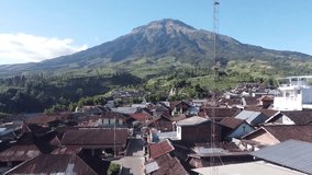 Aerial view of Sumbing mountain slopes in a sunny morning. 4K drone shot - Mount Sumbing, Central Java, Indonesia
