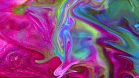 This stock video features an extreme close-up shot of a thick mixture of colored liquid paints spreading on the surface in slow motion that can be used as an organic background for visual effects.