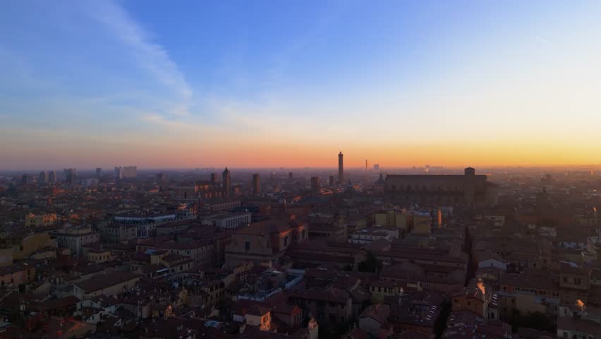 Aerial 4k footage of historical center of the city of bologna italy taken at sunrise in low light two towers maggiore square san petrinio basilica Royalty-Free Stock Footage #3404236553