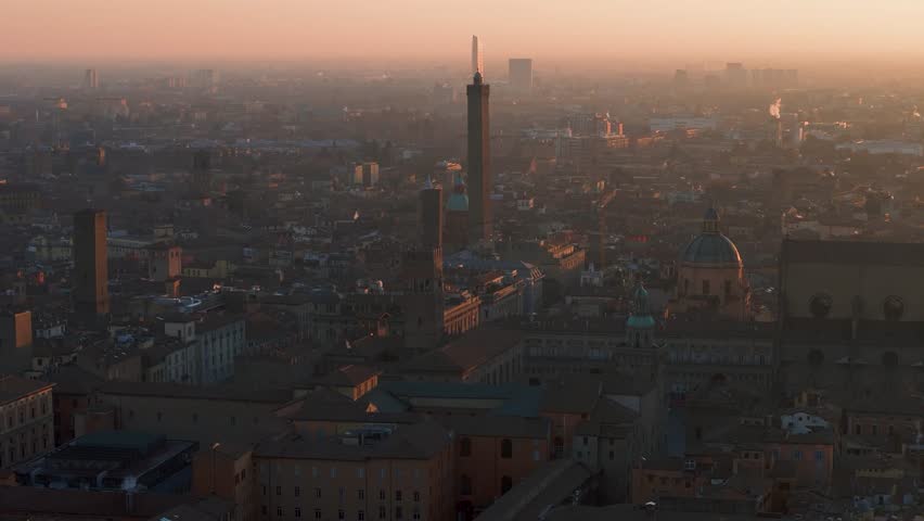 Aerial 4k footage of historical center of the city of bologna italy taken at sunrise in low light two towers maggiore square san petrinio basilica Royalty-Free Stock Footage #3404262185