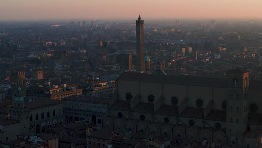 Aerial 4k footage of historical center of the city of bologna italy taken at sunrise in low light two towers maggiore square san petrinio basilica Royalty-Free Stock Footage #3404285383