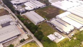 Video Drones. Aerial Footage. Panoramic view of the Industrial zone which contains several factories from various companies. Aerial Shot from a flying drone. Bandung - Indonesia, Asia