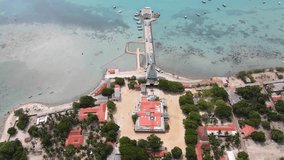 This captivating aerial video provides a panoramic view of the Sri Nagapooshani Amman Temple, located on the picturesque island of Nainativu, near Jaffna, Sri Lanka. The temple, a beacon of Hindu fait