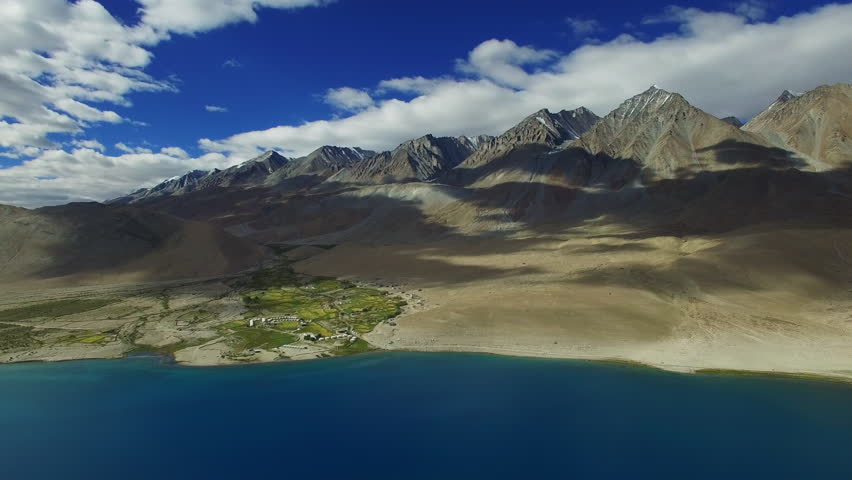 Aerial View. Himalayan lake. Flying over the beautiful lake near mountains. Aerial camera shot. Landscape panorama. Himalaya. Pangong Lake, Leh Ladakh, 4600m high from the ground.
