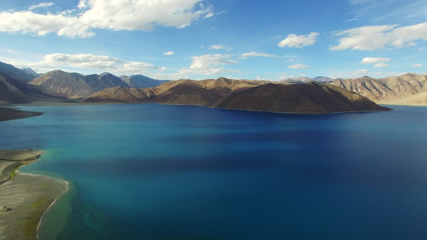 Aerial View. Himalayan lake. Flying over the beautiful lake near mountains. Aerial camera shot. Landscape panorama. Himalaya. Pangong Lake, Leh Ladakh, 4600m high from the ground.
