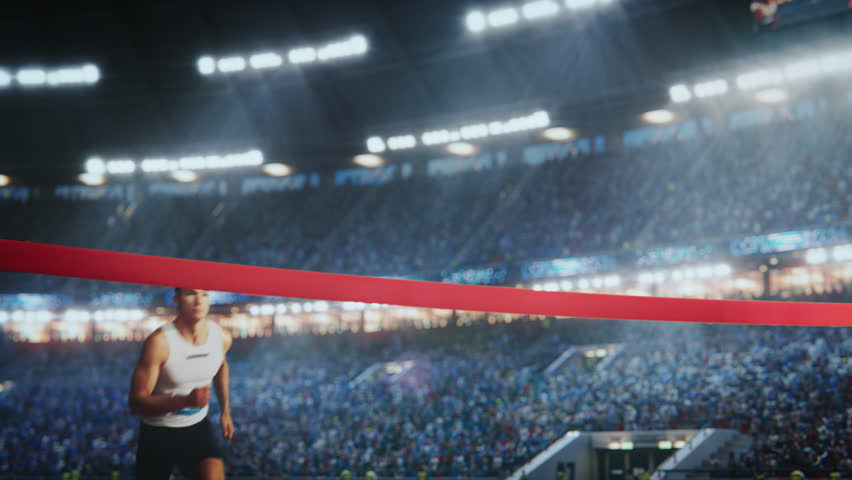 Fit Athlete Finishing a Sprint Run at a Crowded Arena with Cheering Spectators. Young Man Crossing the Finish Line with a Red Ribbon. Cinematic Super Slow Motion Sports Footage Royalty-Free Stock Footage #3404443239