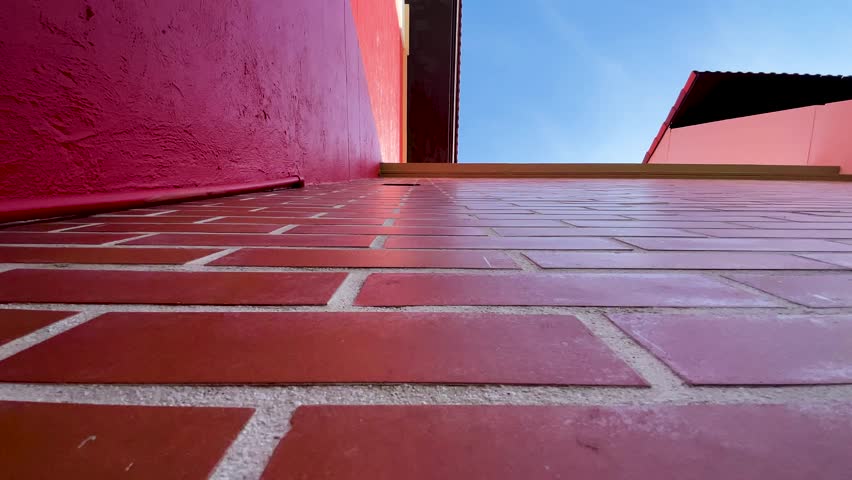 red brick wall house Slow moving photo from a low angle