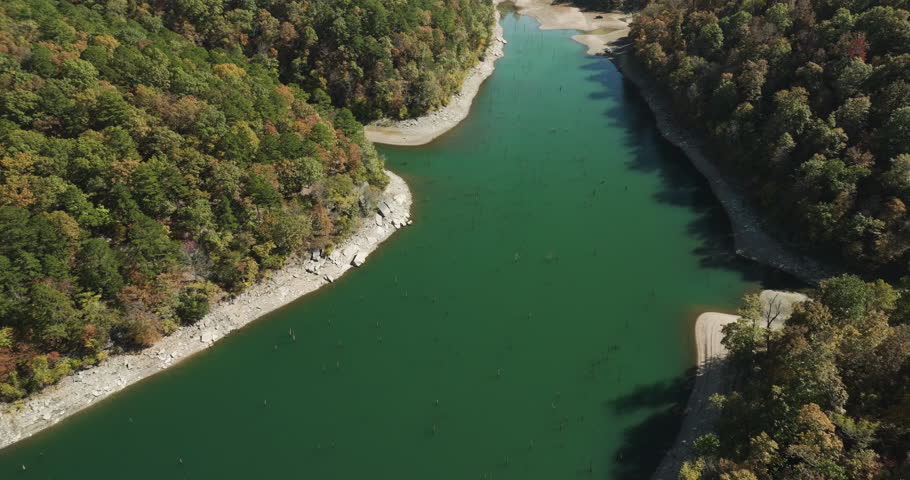 Calm Lake And Lush Autumn Forest In Eagle Hollow, Arkansas, USA - Aerial Shot