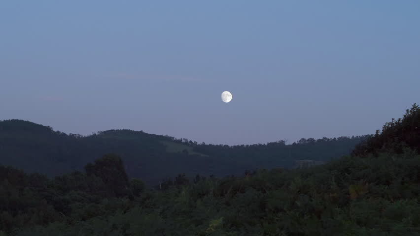 View of Moon Over Mountains in Spain, Asturias. Moonrise at Dusk