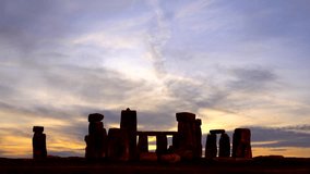 Stonehenge with colorful sunset sky. Time lapse.