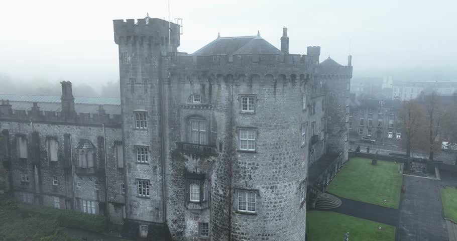 Aerial footage of a foggy castle in 4k