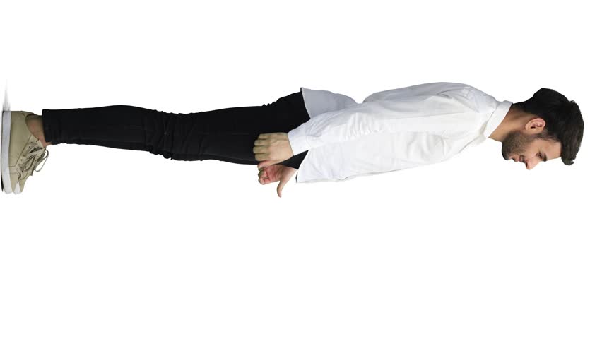 man on a white background. in full height. shows thumbs up sign, in profile